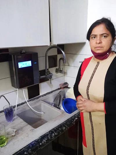 women enjoying the ease of use of his Chanson Quality Water Purifier