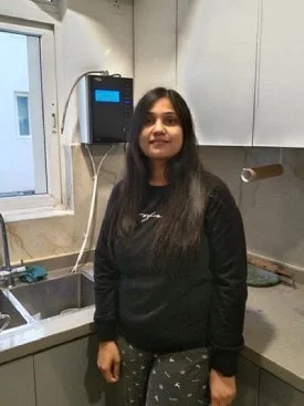 girl demonstrating ease of use of the Chanson Water Purifier