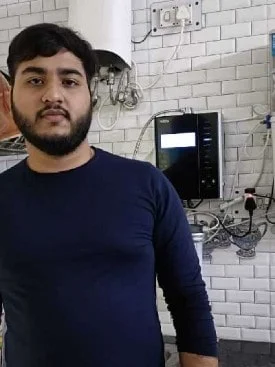 Male customer happily using the Chanson Quality Water Purifier