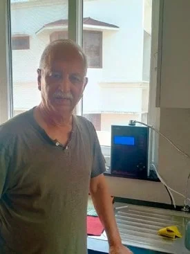 Chanson Quality Water Purifier serving a man with clean water