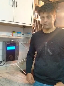 Healthy hydration achieved by a man using Chanson Quality Water Purifier