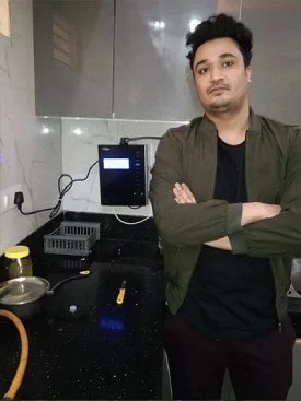 Individual admiring the effectiveness of his Chanson Quality Water Purifier