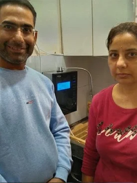 male customer enjoying the efficiency of the Chanson Quality Water Purifier