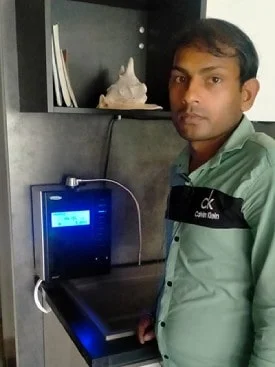 Man relishing the taste of water from his Chanson Quality Water Purifier