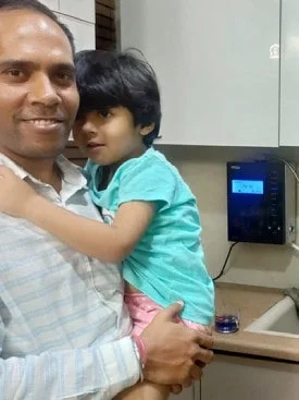 Chanson Quality Water Purifier serving a satisfied male customer