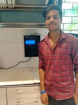 Satisfied male customer with his Chanson Quality Water Purifier