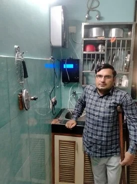 Male enjoying pure, fresh water from his Chanson Quality Water Purifier