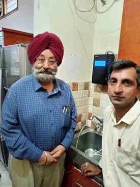 Chanson Quality Water Purifier serving a man with clean water