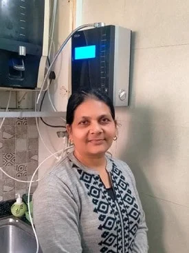 Healthy hydration achieved by a women using Chanson Quality Water Purifier