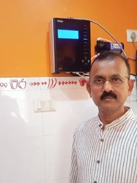 Male consumer trusts Chanson Quality Water Purifier for clean water