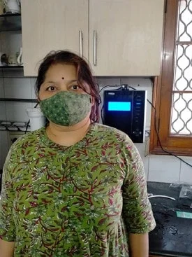 female demonstrating ease of use of the Chanson Water Purifier