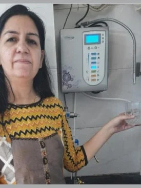 female user quenching his thirst using the Chanson Quality Water Purifier