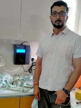 Man ensuring his water is clean with the Chanson Quality Purifier