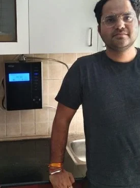 Chanson Quality Water Purifier serving a satisfied male customer