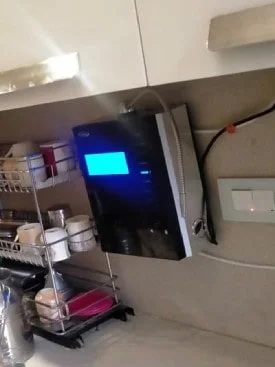 Lady confidently using the Chanson Quality Water Purifier