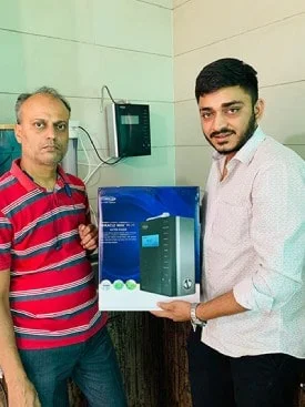 Individual admiring the effectiveness of his Chanson Quality Water Purifier