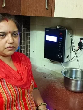 Female enjoying clean, purified water from the Chanson Quality Water Purifier