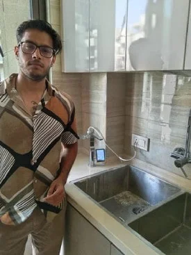 Man at home with his Chanson Quality Water Purifier