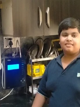 man demonstrating how to use the Chanson Quality Water Purifier