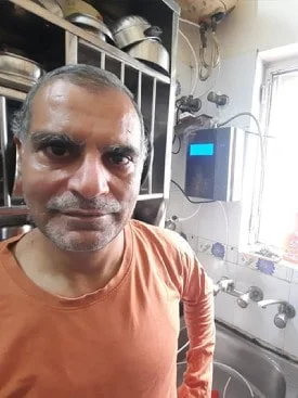 Man relies on Chanson Quality Water Purifier for pure water