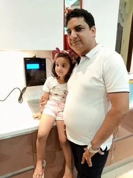 Male customer enjoying the efficiency of the Chanson Quality Water Purifier