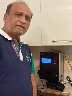 Individual admiring the effectiveness of his Chanson Quality Water Purifier