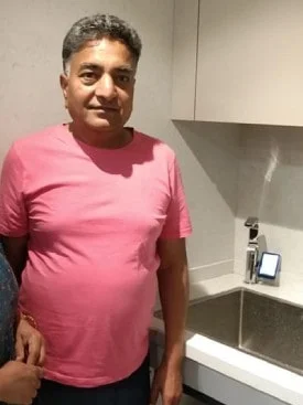 Male customer happily using the Chanson Quality Water Purifier