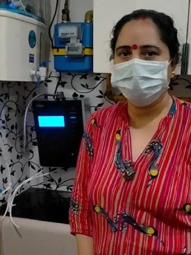 female demonstrating ease of use of the Chanson Water Purifier