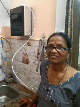 women quenching thirst with water from the Chanson Quality Purifier