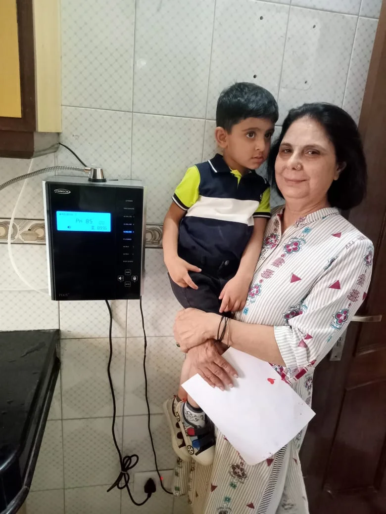 women enjoying the ease of use of his Chanson Quality Water Purifier