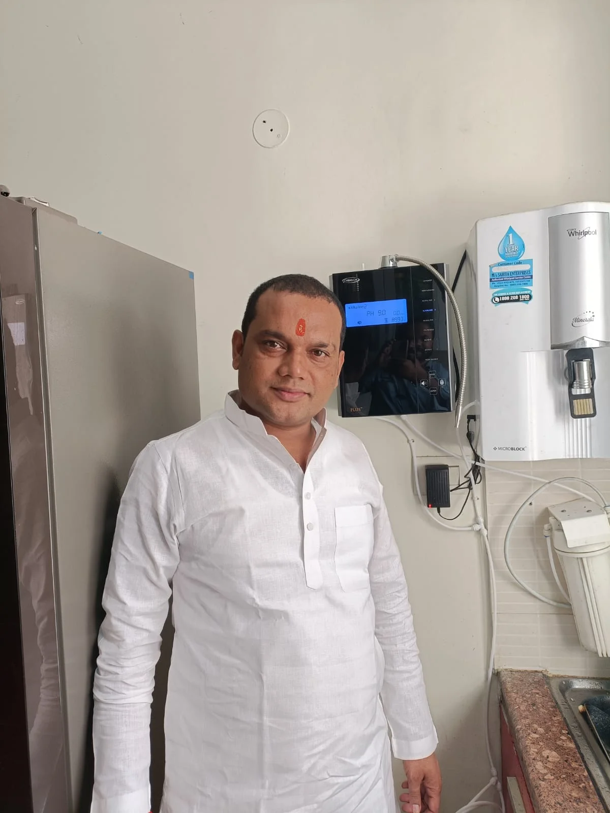 Man at home with his Chanson Quality Water Purifier