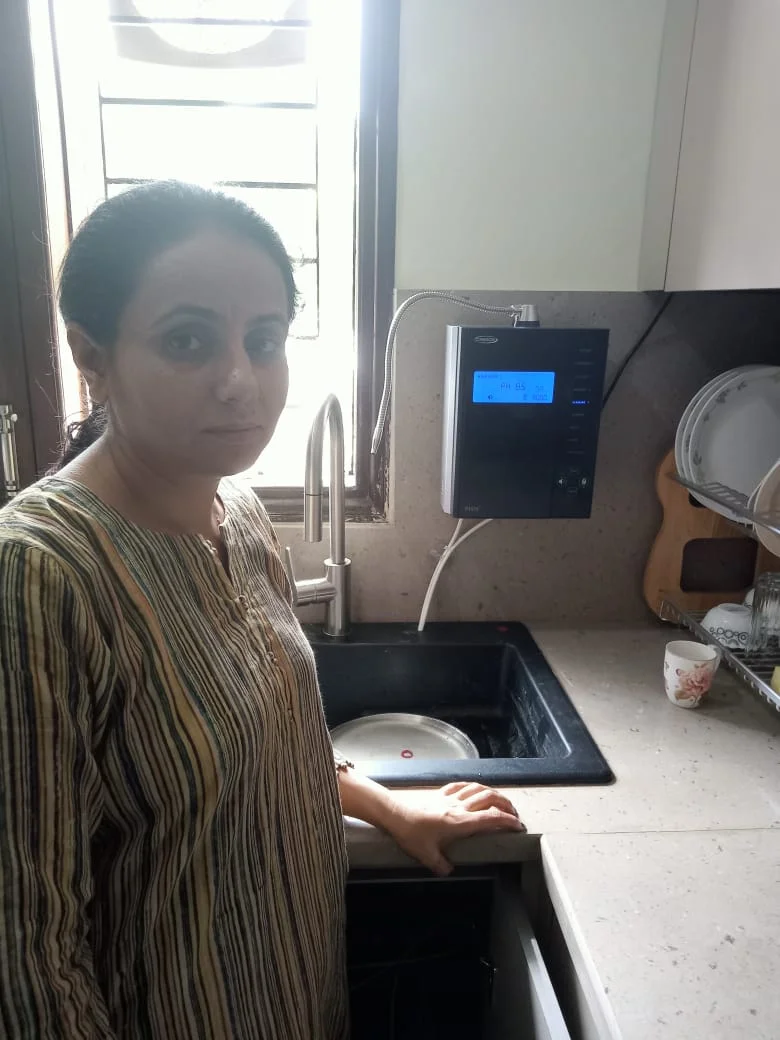 Individual admiring the effectiveness of his Chanson Quality Water Purifier