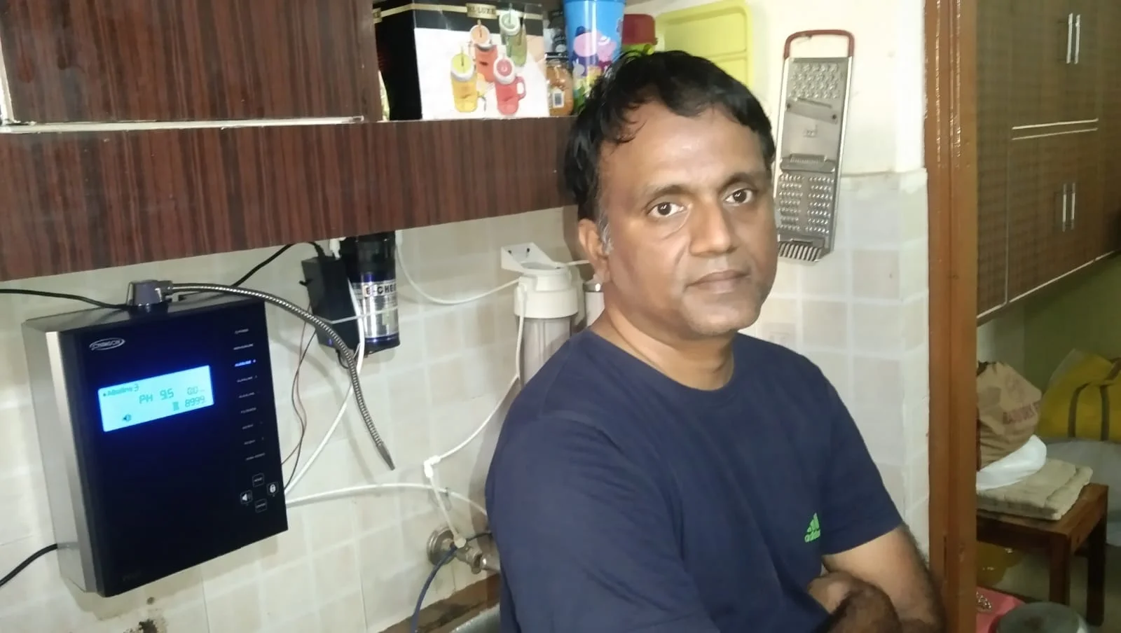 men demonstrating how to use the Chanson Quality Water Purifier