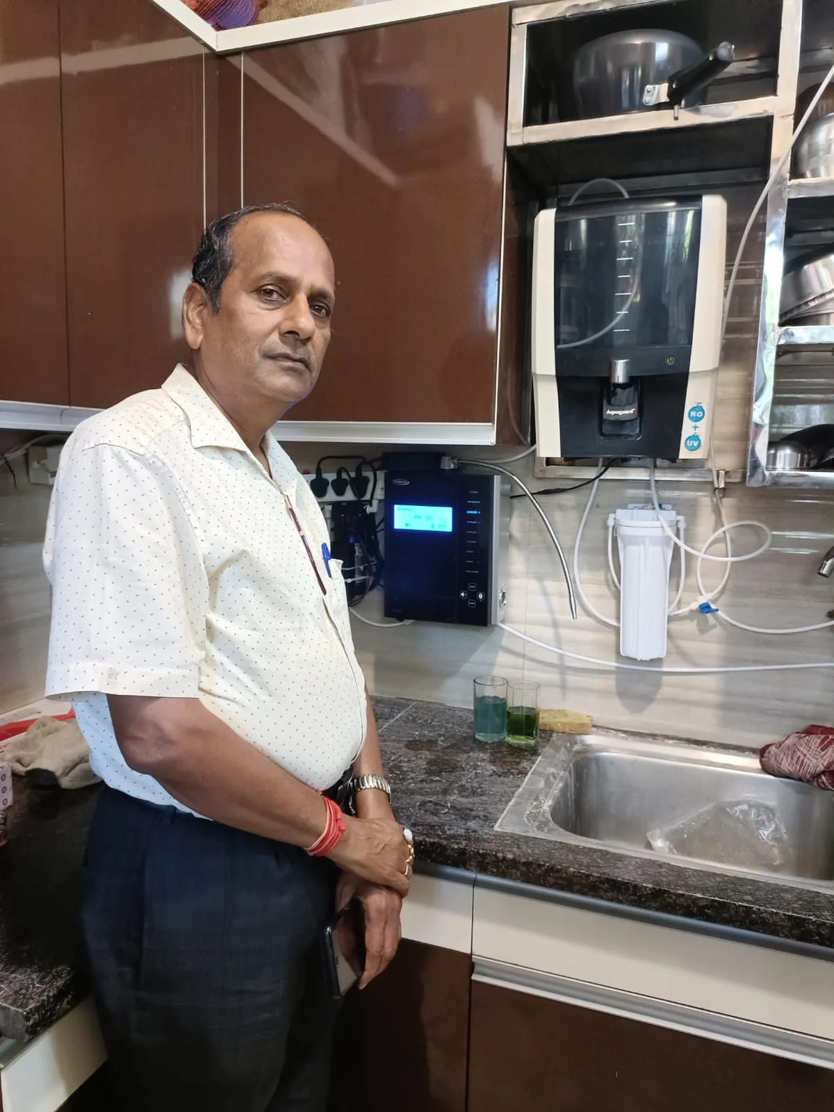 Man showcasing the convenience of using Chanson Quality Water Purifier