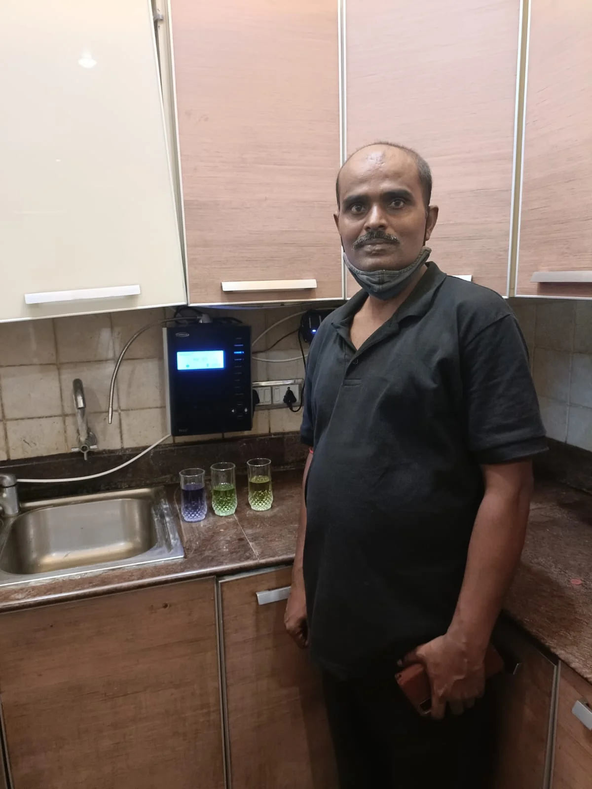 Male taking a water break with his Chanson Quality Water Purifier