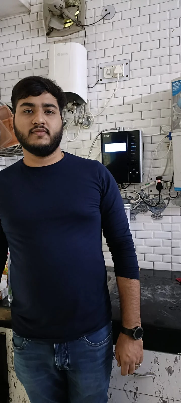 Chanson Quality Water Purifier serving a satisfied male customer