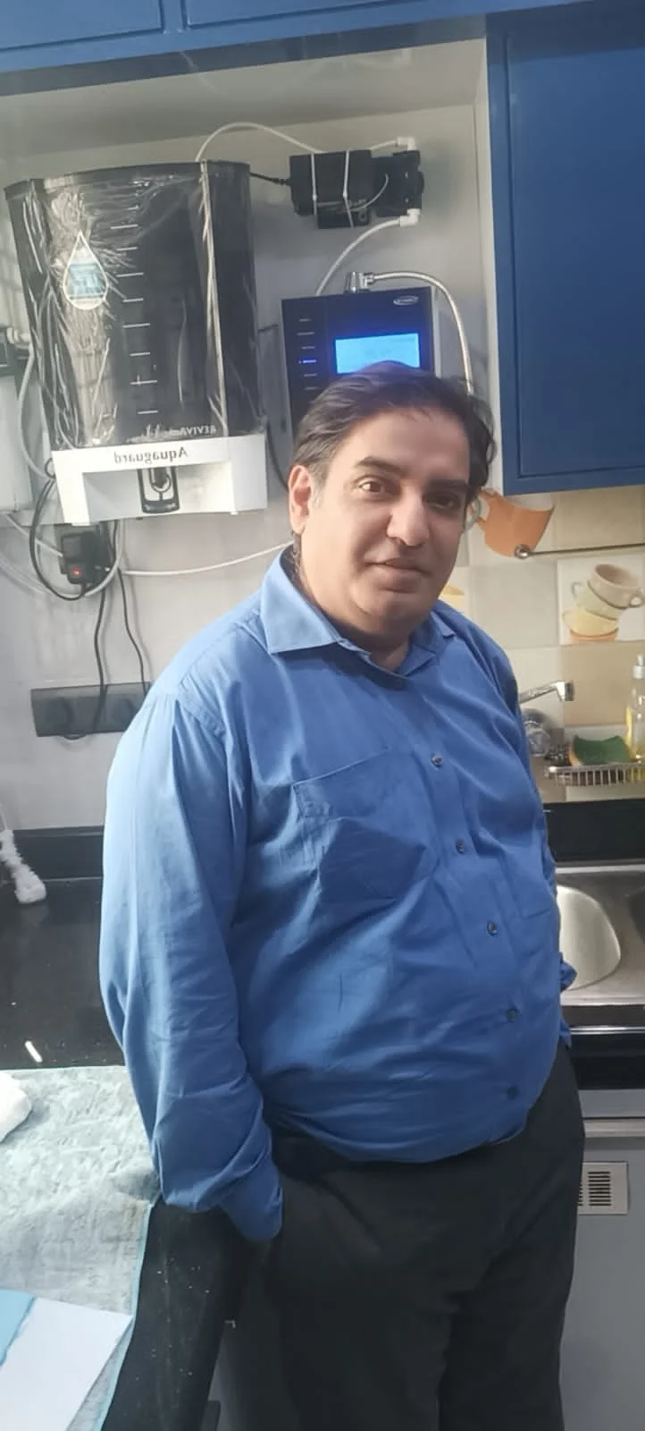 Satisfied male customer with his Chanson Quality Water Purifier