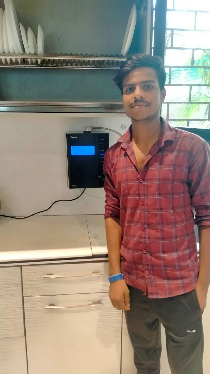 Man showcasing the convenience of using Chanson Quality Water Purifier