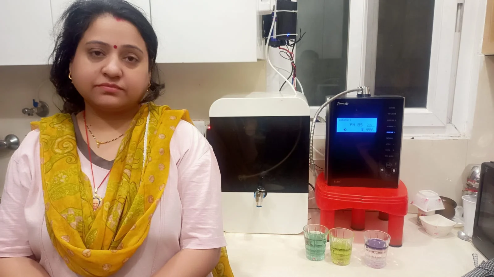 women assured of his water's purity with the Chanson Quality Water Purifier