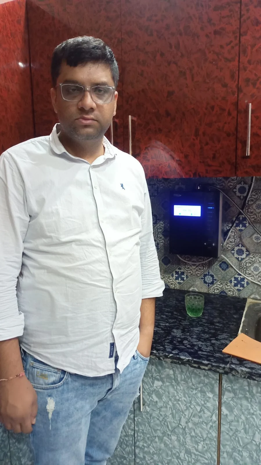 Chanson Quality Water Purifier being operated by a health-conscious man