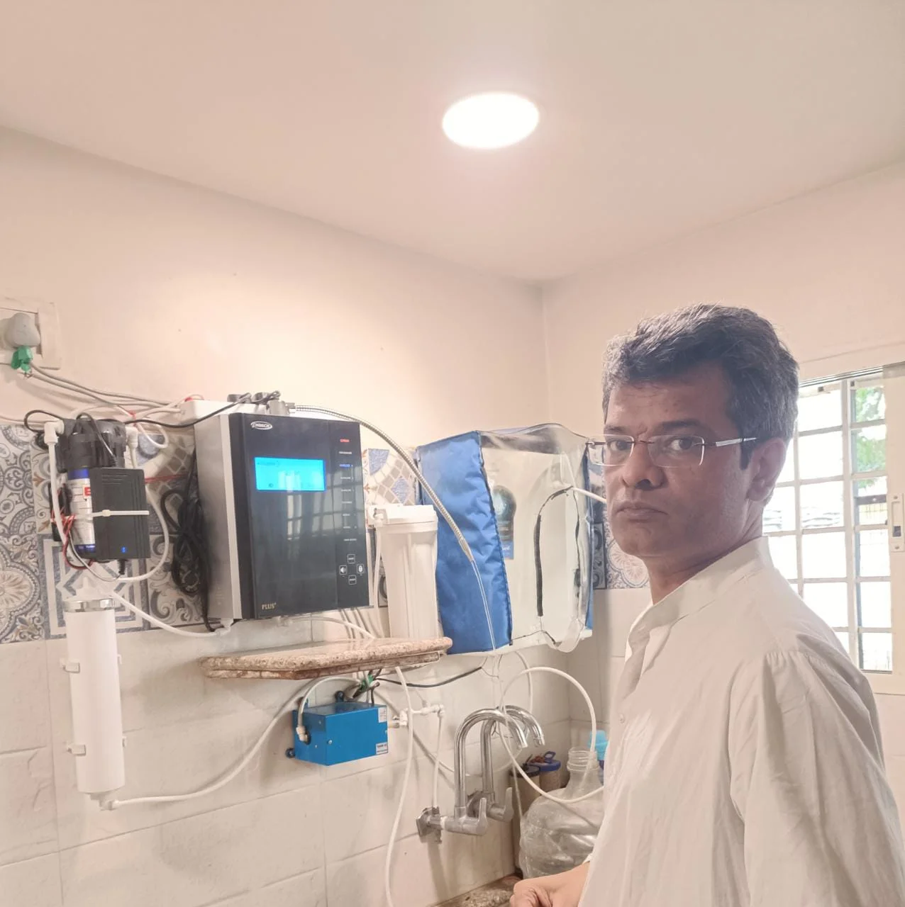 Satisfied male customer with his Chanson Quality Water Purifier