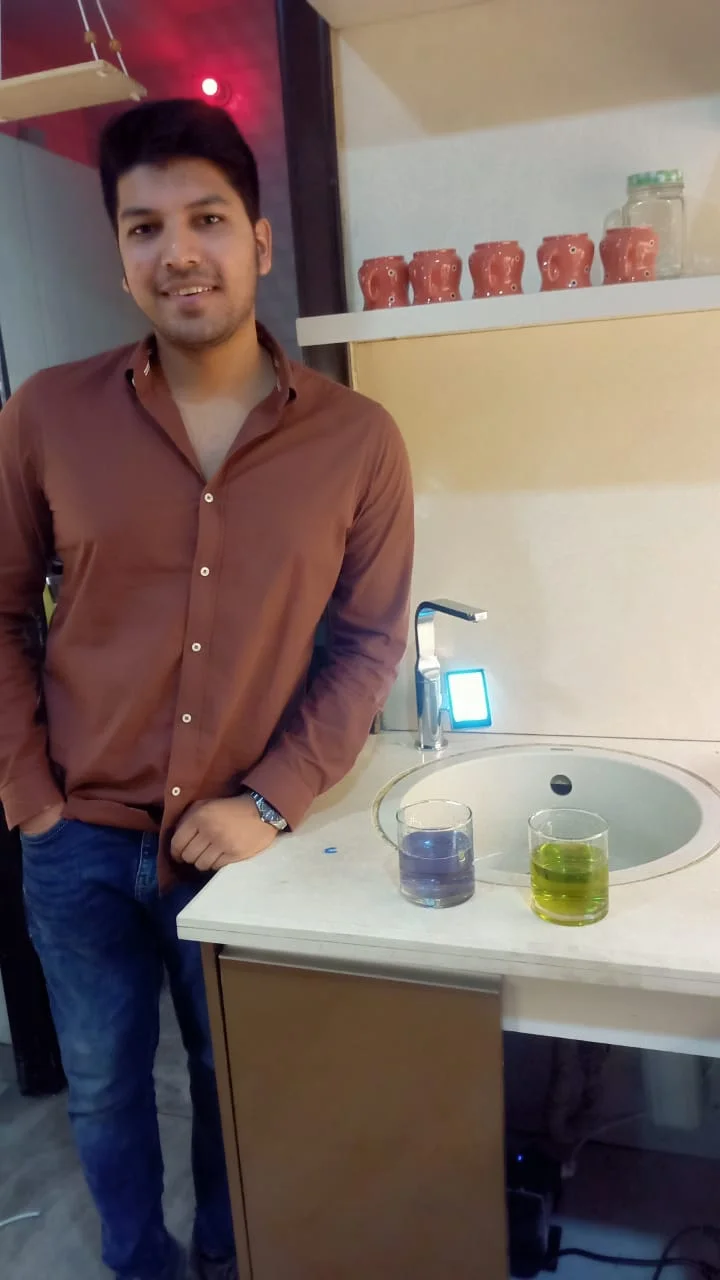 Man operating the advanced Chanson Quality Water Purifier in his home